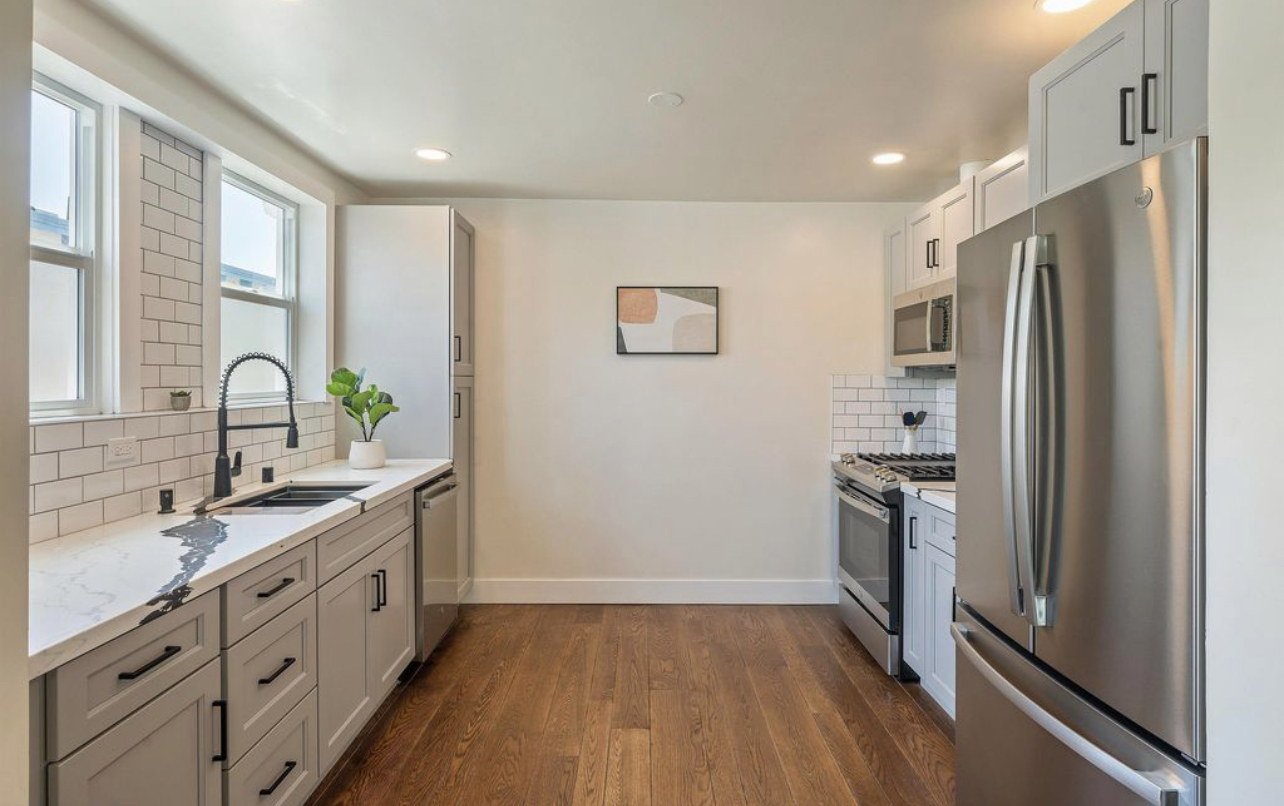 Clean multifamily unit kitchen prepared for a new resident